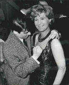 Mike autographing actress Patsy Fagan's chest