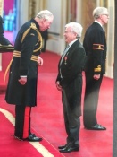 Mike receiving his MBE award from Prince Charles, now King Charles lll, at Buckingham Palace