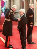 Mike receiving his MBE award from Prince Charles 